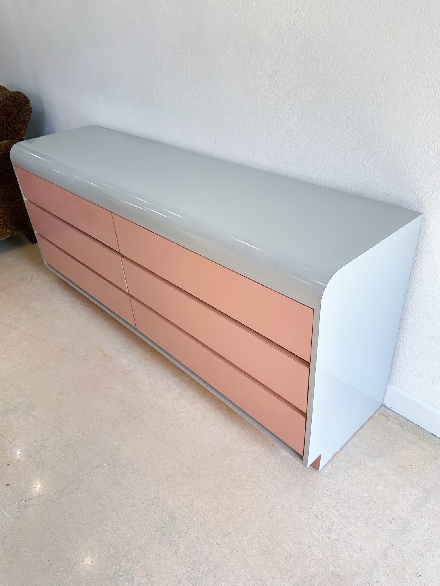gray and pink dresser Gray Campaign Dresser with White and Pink Tassel Lamps - Contemporary